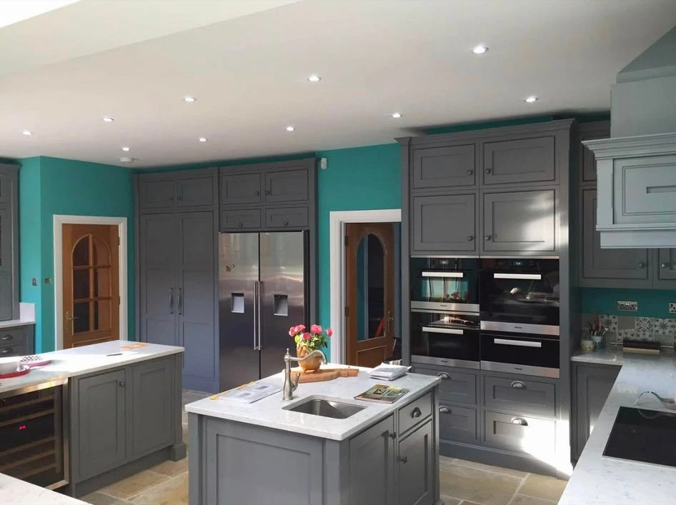 Downlights across a large kitchen with built-in ovens