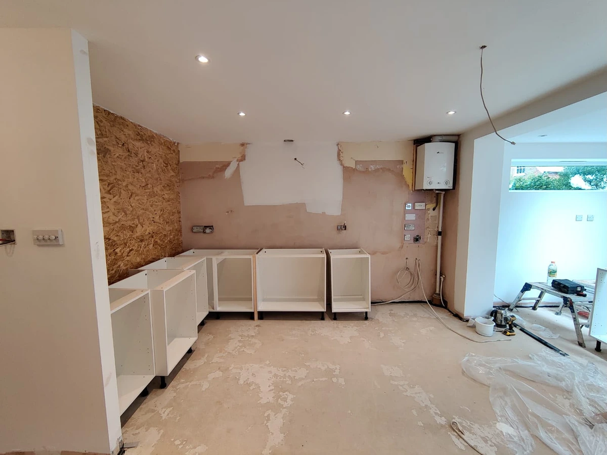 First fix back boxes and downlights in a stripped kitchen
