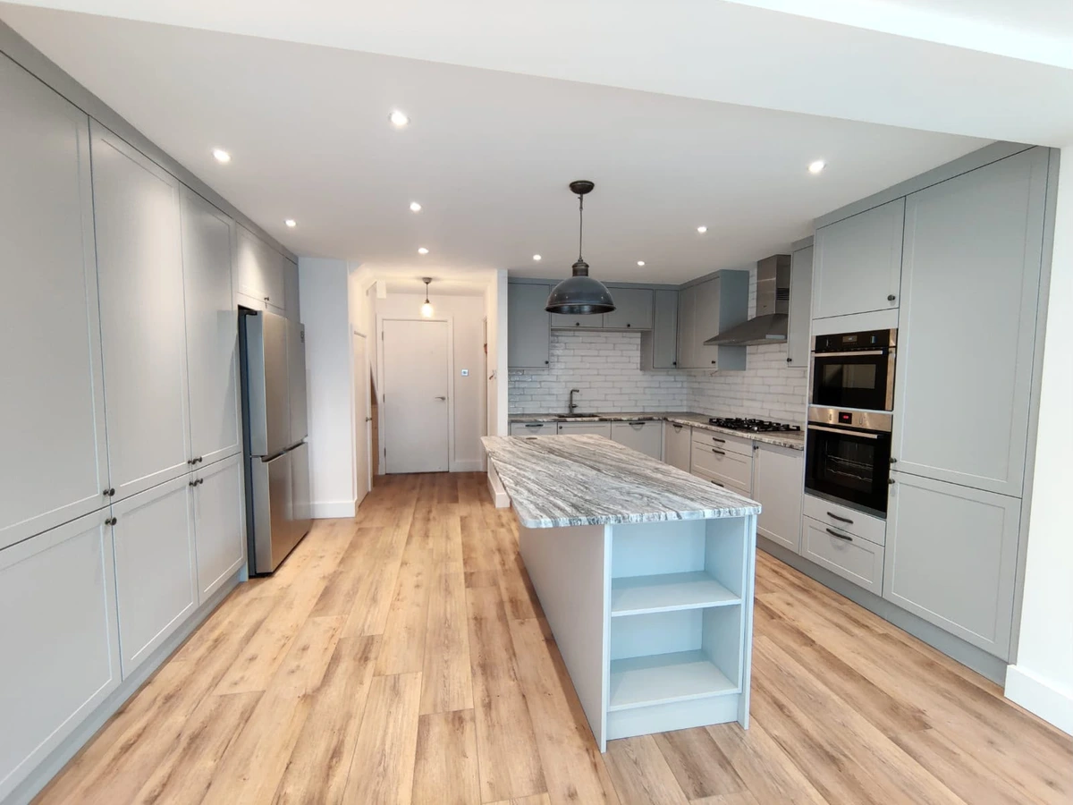 Downlights and a pendant above a kitchen island