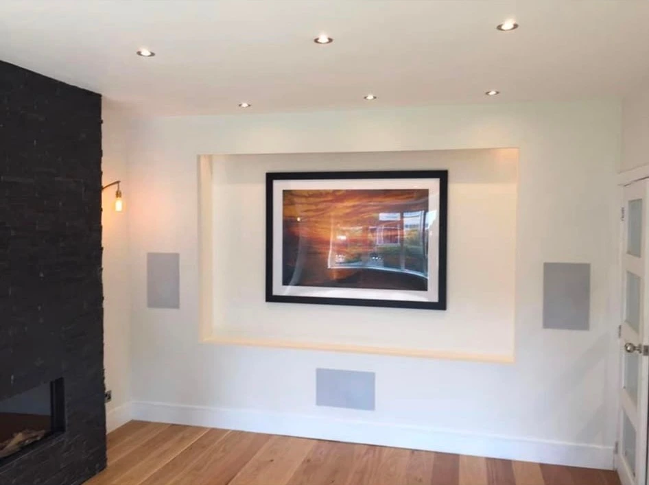 Ceiling downlights and a wall light in a finished living room