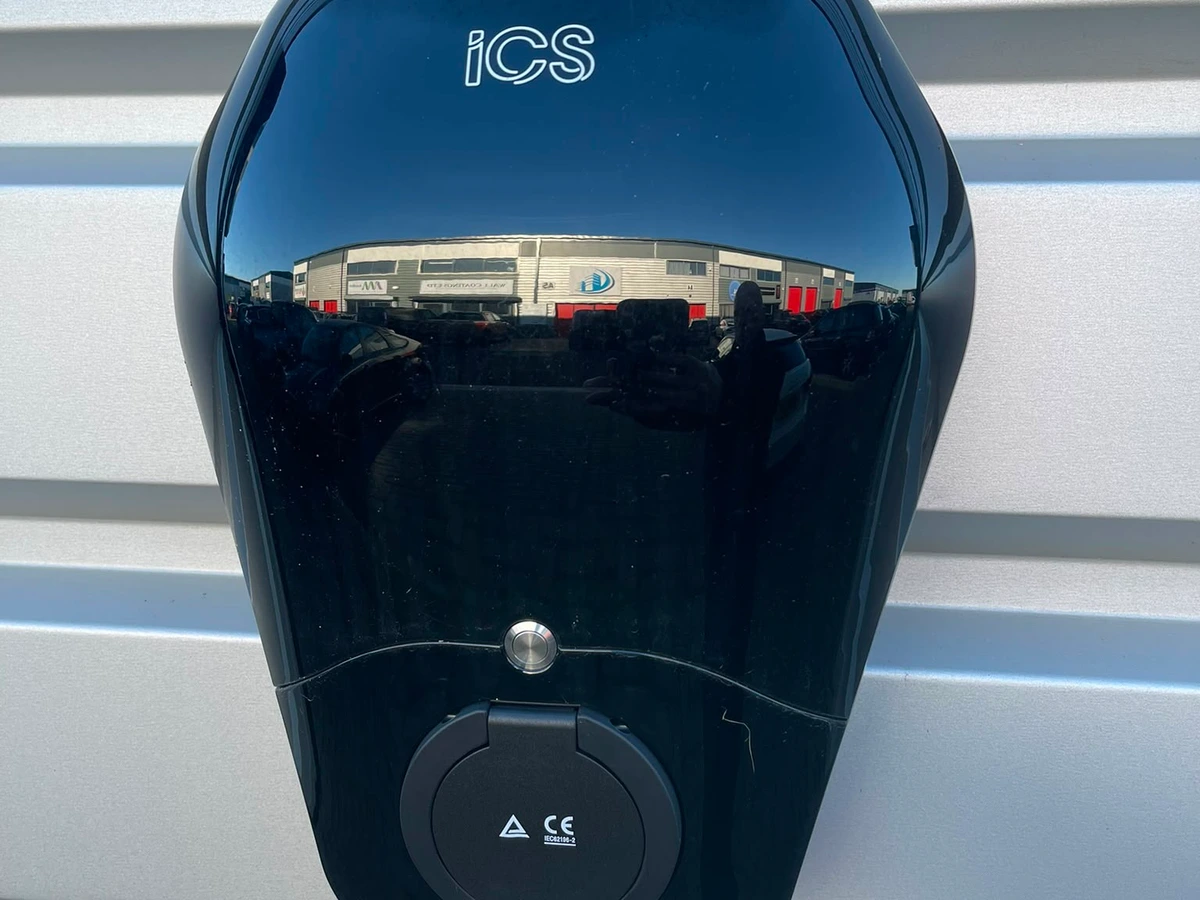 EV charge point mounted on an external clad wall